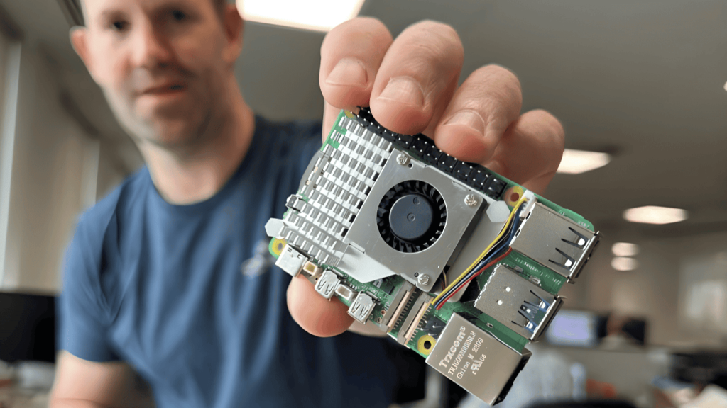 Eben showing off a prototype of the Active Cooler for Raspberry Pi